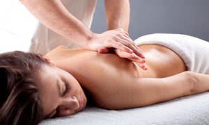 woman laying on table being massaged