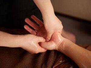 picture of one hand massaging another